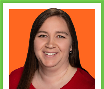 Female profile photo, against orange background